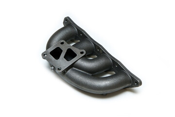The new cast iron car engine air intake manifold isolated in a white background.  - obrazy, fototapety, plakaty