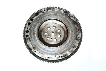 The rusty old used engine flywheel isolated in a white background. 