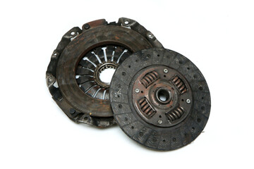 The old rusty used clutch from the car engine isolated in a white background. Has to be changed for new one. 