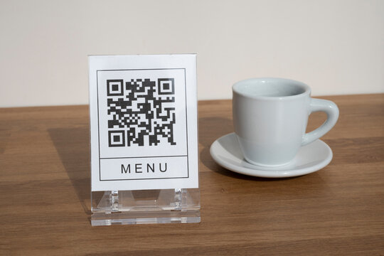 QR code for online menu service at table in restaurant. New contactless technology lifestyle protection coronavirus pandemic in restaurant. 