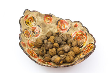walnuts in a clay pot