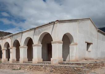 Obraz premium Imposing ruins of abandoned houses on the road between Cachi and Cafayate, Salta Province, Northern Argentina