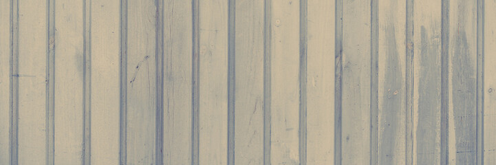 Wood texture. Fence from gray wooden planks. Wooden wall. Wide panoramic rustic texture for background and design.