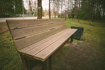 wooden bench in park, close up, perspective