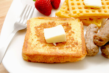 Fried French Toast served on a Plate with Butter