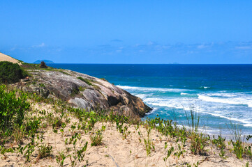 view of the rocks and the sea on Gamboa beach in Santa Catarina