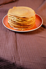 Delicious homemade fried pancakes with natural ingredients, plate with homemade pancakes