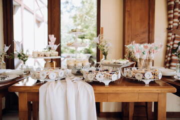 Table with desserts in the restaurant. Sweet food at a wedding party
