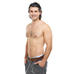 Fototapeta premium Rugged and charming. Studio portrait of a handsome, shirtless man posing against a white background.