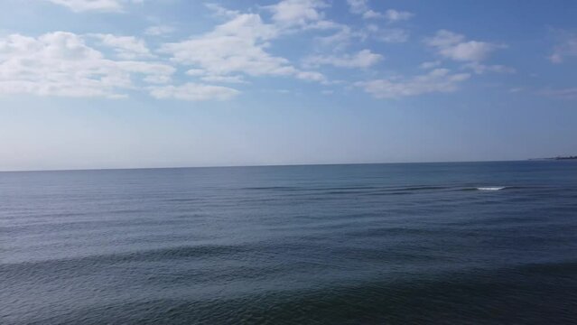 View of the Black Sea opens the beach. People relax, have fun and sunbathe on the Black Sea coast in Zatoka, Ukraine, 2021. 4k, 25fps