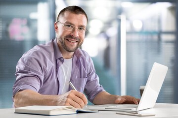 Modern Office, Businessman Works on Laptop, Does Data Analysis and Creative Designer