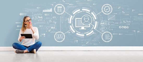Document management system concept with young woman holding a tablet computer