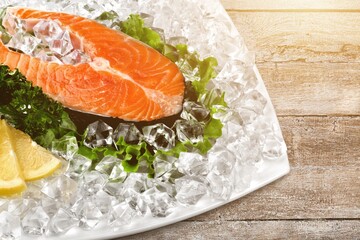 Fresh fish fillet. On a wooden background.