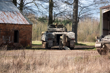 British army Warrior FV510 light infantry fighting vehicle tank parked ready to resume action on a military exercise, Salisbury Plain, Wiltshire UK