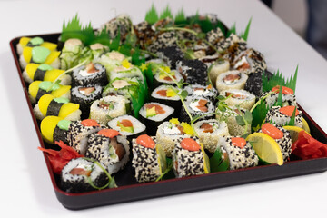 sushi, Japanese cuisine. Various types of sushi on a platter