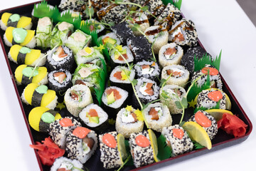 sushi, Japanese cuisine. Various types of sushi on a platter