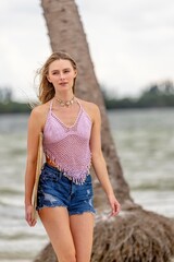 Lovely Blonde Model Enjoying A Summers Day While Preparing To Surf On The Ocean With Her Boogie Board