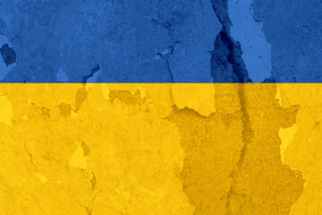 National Ukrainian flag with cracked background. Wallpaper with cracks. Ukraine.