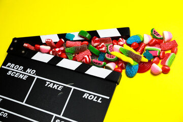 movie clapperboard with candy
