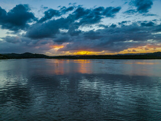 Sunrise and rain clouds waterscape