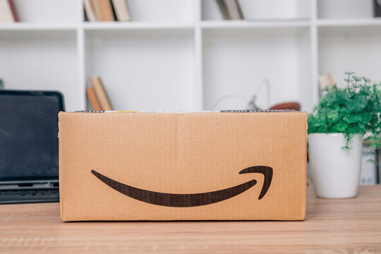 Galicia, Spain - March 12, 2022: Parcel or shipping packaging with amazon e-commerce company logo