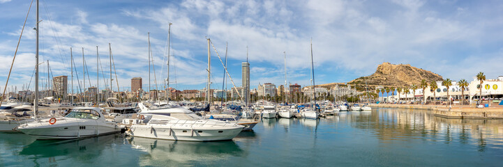 Fototapeta na wymiar Alicante Port d'Alacant marina with boats and view of castle Castillo travel traveling holidays vacation panorama in Spain