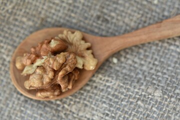 walnut on a wooden spoon on the table