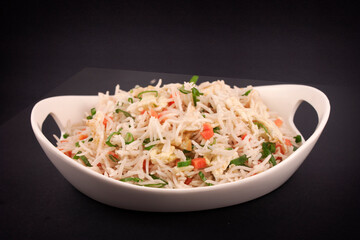 Chinese Vegetable Fried Rice in a  Dish on Black Background.