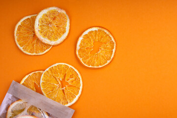 Fototapeta premium Dried oranges on orange background