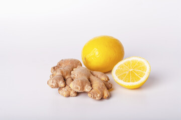 lemon and ginger lie on a white background