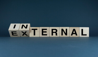 Cubes form the words external - internal. Business Concept