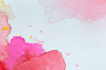 Macro close-up of an abstract colorful watercolor gradient fill background with watercolour stains. High resolution full frame textured white paper background.