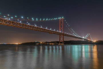 Night landscape at Ponte 25 de Abril in Lisbon, Portugal