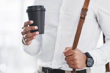 Hes one well-dressed businessman. Closeup shot of an unrecognisable businessman holding a coffee cup in an office.