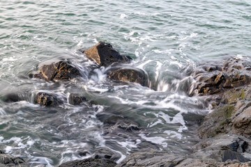 rugged stony surf along coast line