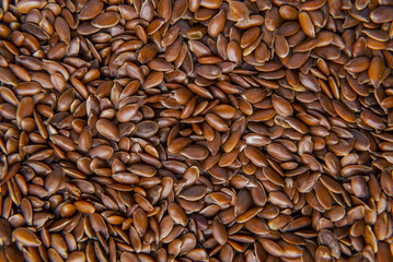 Wooden spoons with flaxseed close-up background pattern  Top view Flax seeds background or texture. flaxseed or linseed. Cereals. Healthy food. top view. High quality photo
