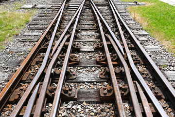 Obraz premium Rails converging at a set of points on a railway track. No people.