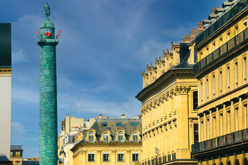 Obraz premium The landmark green column in the center of the Place Vendome square in&nbsp;Paris, France
