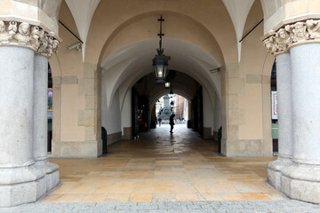 Obraz premium Krakow, Poland. Columns of the renaissance Cloth Hall (Sukiennice) in main square of Krakow. Main market square in Krakow (Poland), listed by UNESCO 
