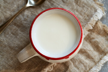 Probiotic kefir in a white and red cup