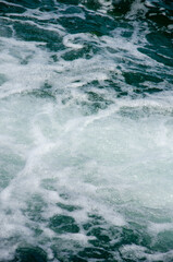 Fototapeta na wymiar Water texture background white marine foam close up