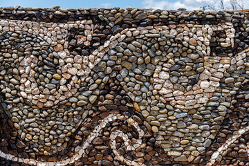 Stone wall with cave figures
