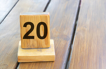 Wooden priority number 20 on a plank tab