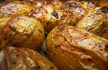 Macro view of baked potatoes with dill.