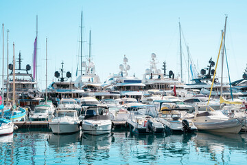 Marine with Boats and yachts on a Monaco yacht show moored in harbour	
