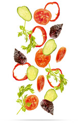 Light spring summer salad with flying floating in air ingredients, fresh vitamin vegetables. Suspended tomato, cucumber, pepper, parsley, basil. Vegetarian vegan healthy food menu