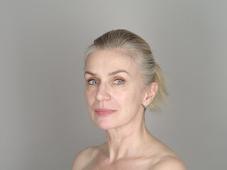 Confident adult model on gray