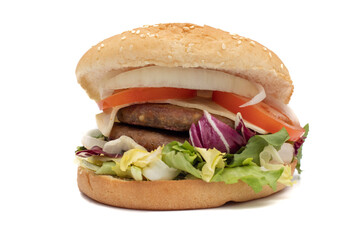 A double meat burger, with the ingredients, lettuce, cabbage, cucumber, tomato, onion, cheese, ketchup, mayonnaise. Isolated on white background. One of the most consumed snacks in the world.