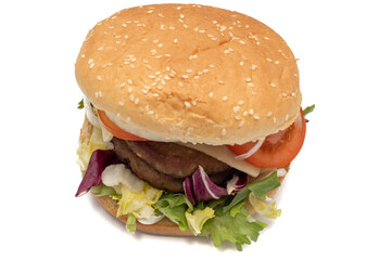 A double meat burger, with the ingredients, lettuce, cabbage, cucumber, tomato, onion, cheese, ketchup, mayonnaise. Isolated on white background. One of the most consumed snacks in the world.