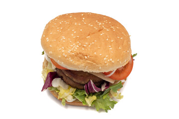 A double meat burger, with the ingredients, lettuce, cabbage, cucumber, tomato, onion, cheese, ketchup, mayonnaise. Isolated on white background. One of the most consumed snacks in the world.